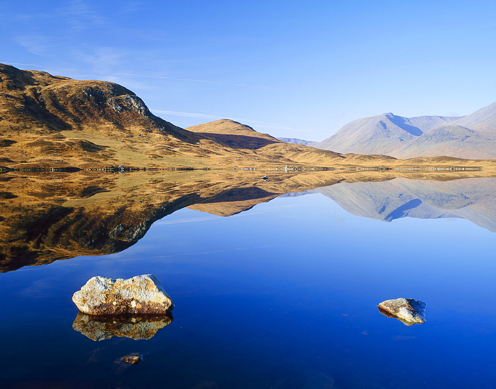 Reflection in calm loch, Black Mount, Rannoch Moor, Highlands, Scotland, UK 