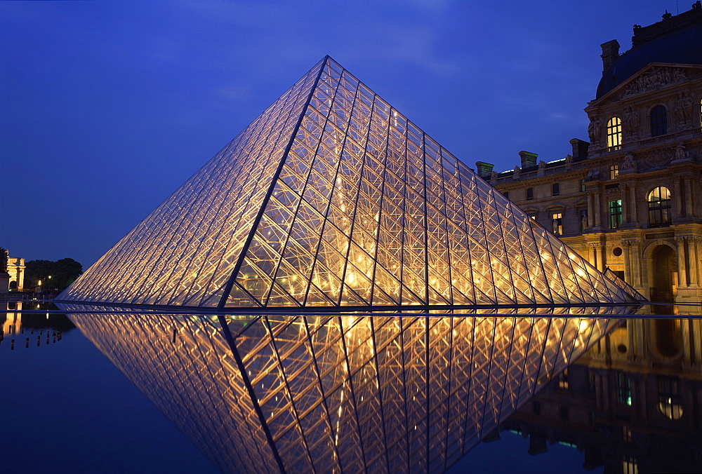 The Pyramide and Palais du Louvre, Musee du Louvre, illuminated at dusk, Paris, France, Europe