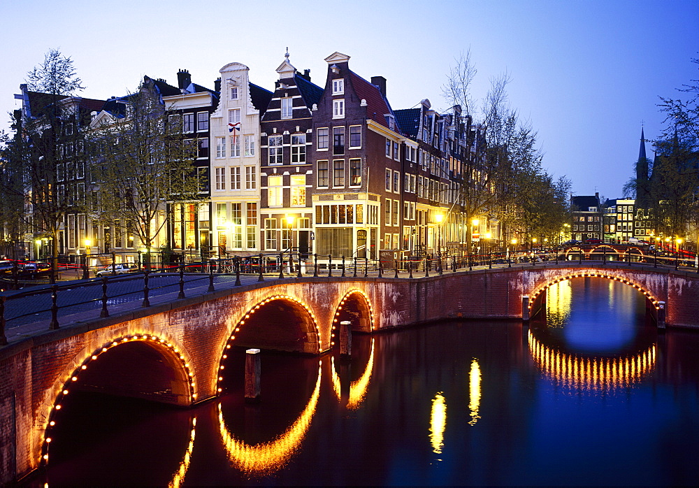 Lights on the bridges at night on the Keizersgracht in Amsterdam, Holland 