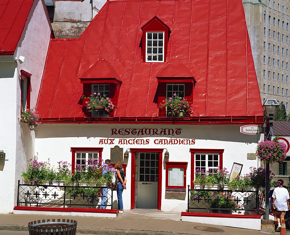 A 17th century house with red roof, now a restaurant, in Quebec City, Quebec, Canada, North America