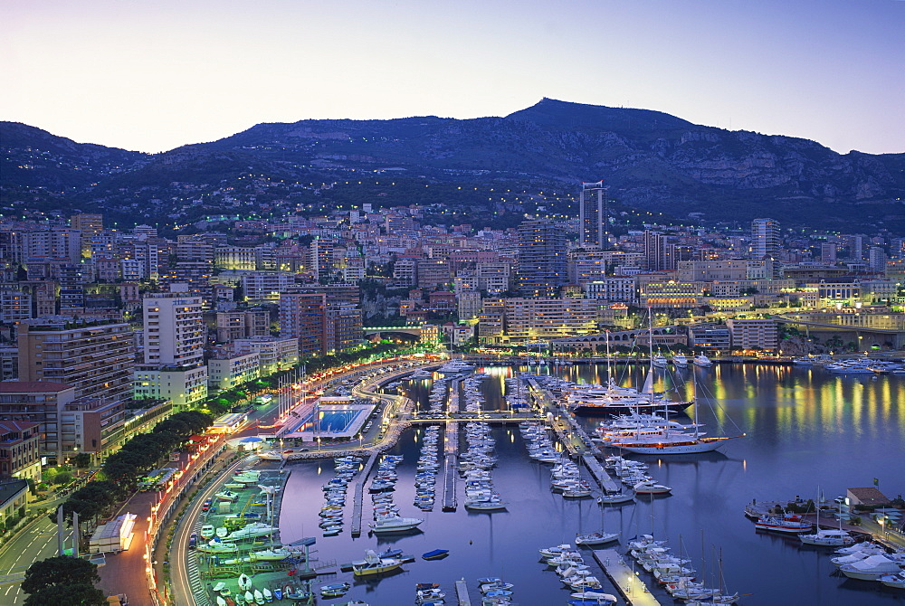 The marina, waterfront and town of Monte Carlo in the evening, Monaco, Mediterranean, Europe