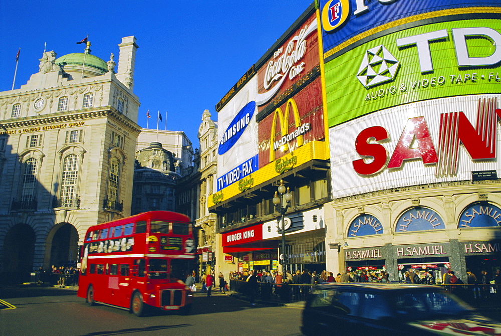 Double decker bus and advertisements, Piccadilly Circus, London, England, UK