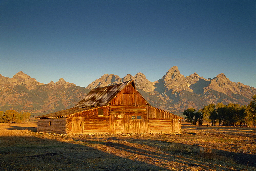 Historic barn and the Teton Range, Grand Tetons National Park, Wyoming, United States of America, North America