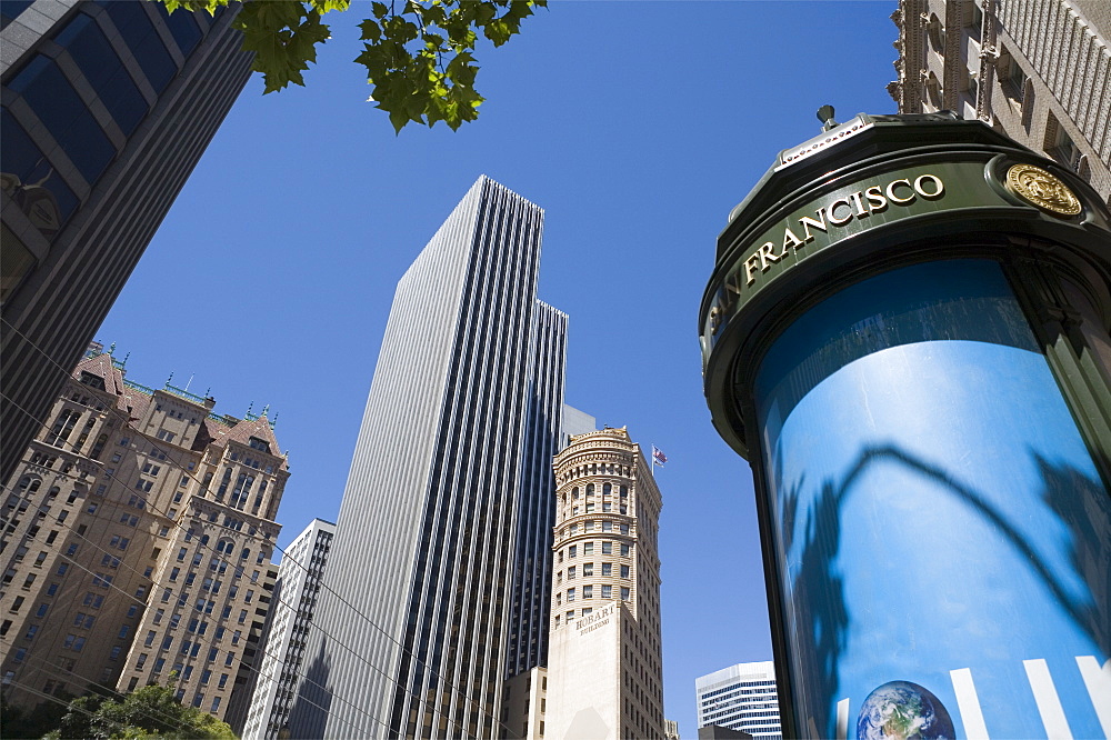 Tall buildings and advertising stand, Market Street, San Francisco, California, United States of America, North America