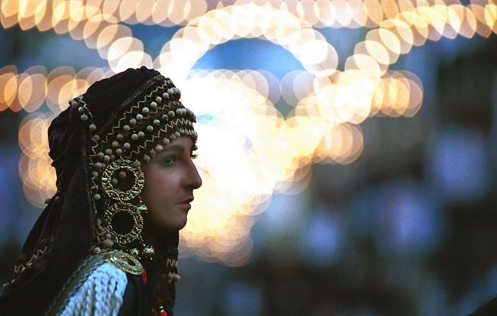 Alcoy,Alicante,Spain - Waiting to be in the parade - a woman in costume during the annual Moors and Christians celebrations