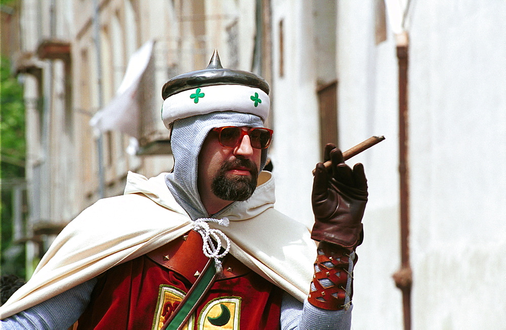 Alcoy,Alicante,Spain  - a cigar-toting Christian arrives in town during the annual Moors and Christians celebrations