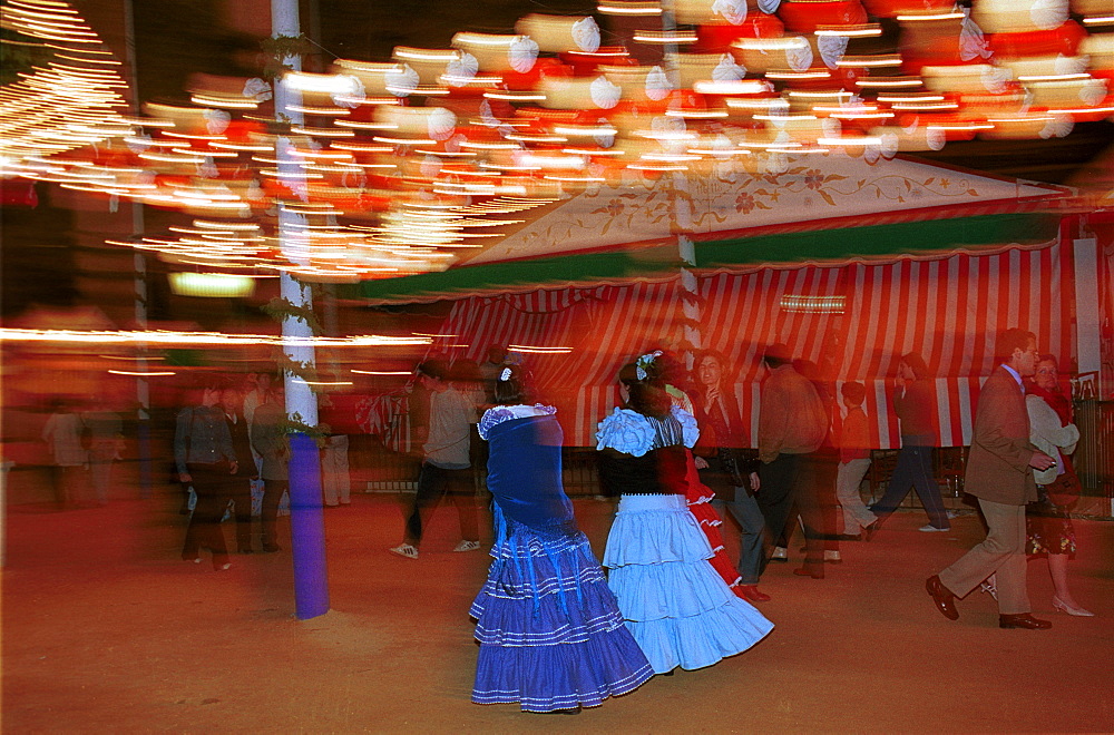 Seville - Spain - The Feria de Abril - Seville Fair - Costumes on view during the night at the fairground