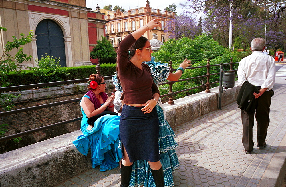 Seville - Spain - The Feria de Abril - Seville Fair - Girls practice their dancing in the city streets 