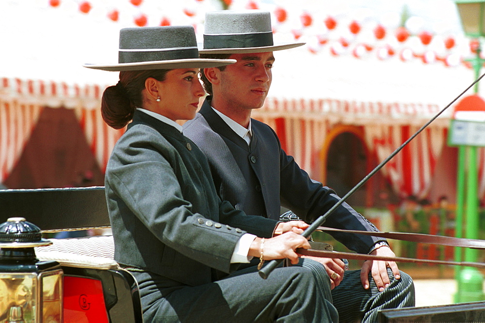 Seville - Spain - The Feria de Abril - Seville Fair - A couple taking a drive in a carriage around the fairground 