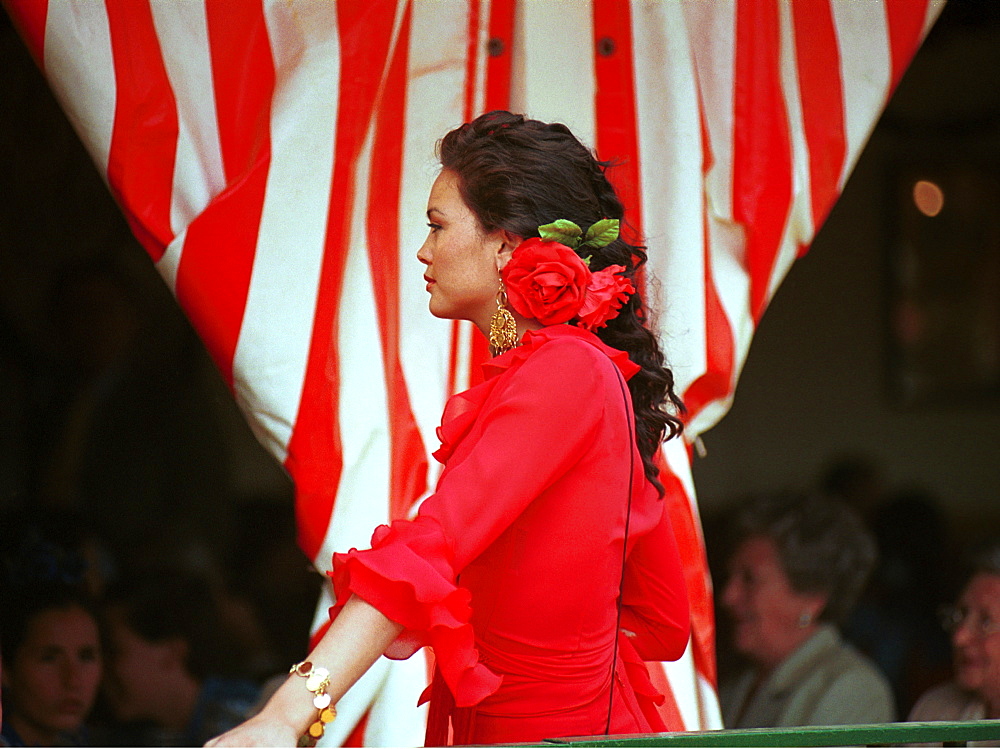 Seville - Spain - The Feria de Abril - Seville Fair - A Sevillana wearing traditional dress 