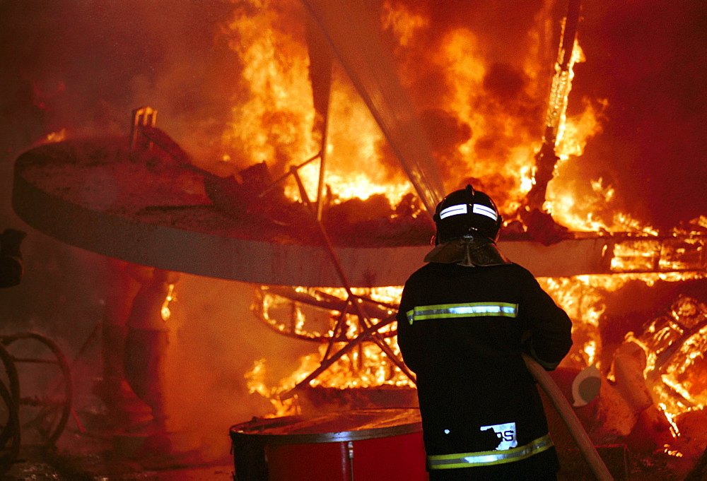 Valencia - Spain - Las Fallas Fiesta - Firemen on duty at the burning of a falla