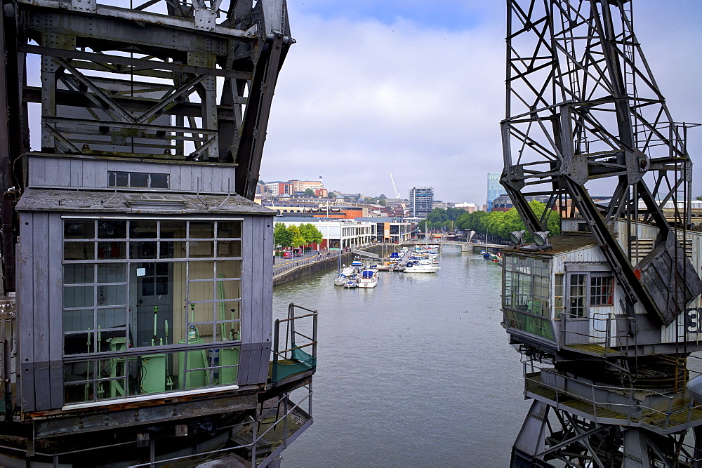 Old dockside cranes frame the harbour, Bristol, England, United Kingdom, Europe