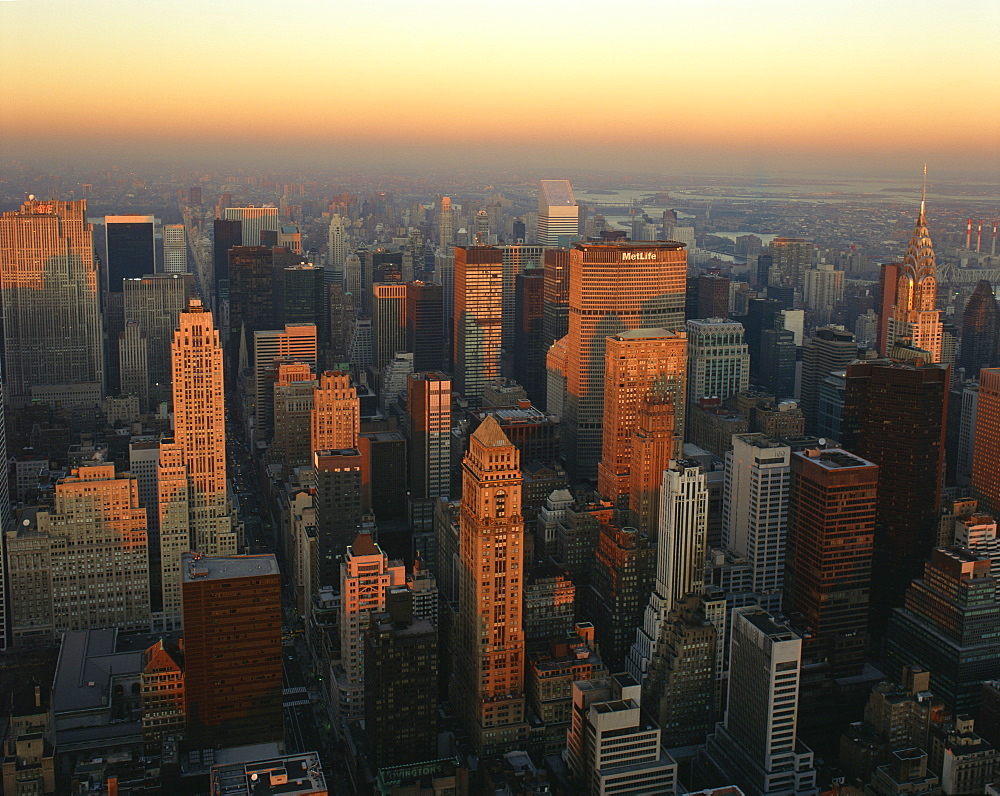 The Manhattan skyline at dusk, including the Chrysler Building, viewed from the Empire State Building, New York City, United States of America, North America