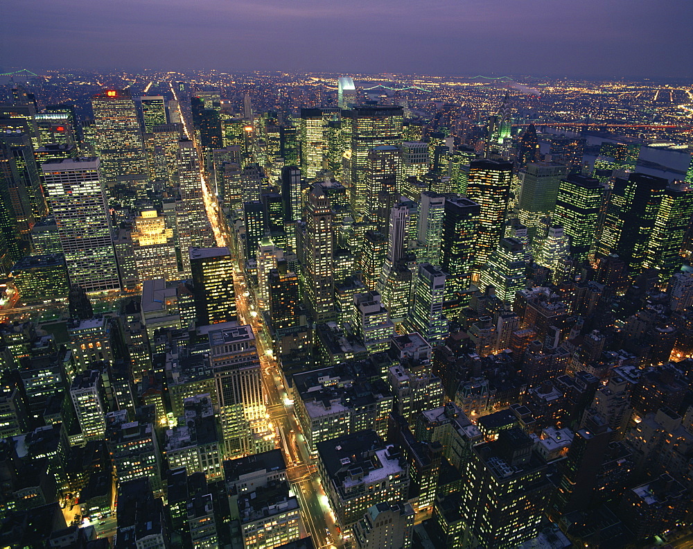 Aerial view at night of the city lights taken from the Empire State building and looking up Fifth Avenue, New York, United States of America, North America