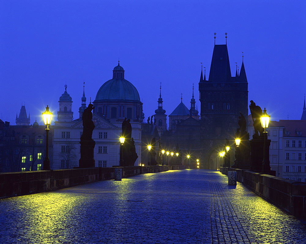 The Charles Bridge at night and city skyline with spires, UNESCO World Heritage Site, Prague, Czech Republic, Europe