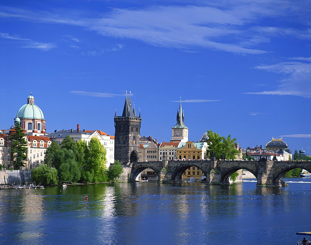 The Charles Bridge over the Vltava River and city skyline of Prague, Czech Republic, Europe