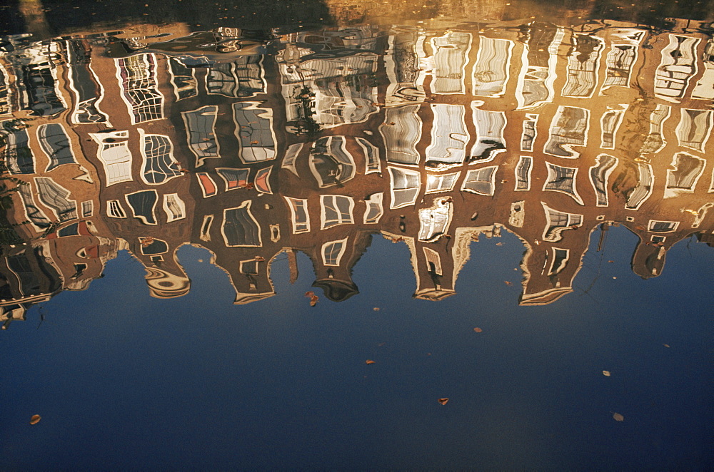 Reflection of buildings in water of a canal, Amsterdam, Netherlands, Europe