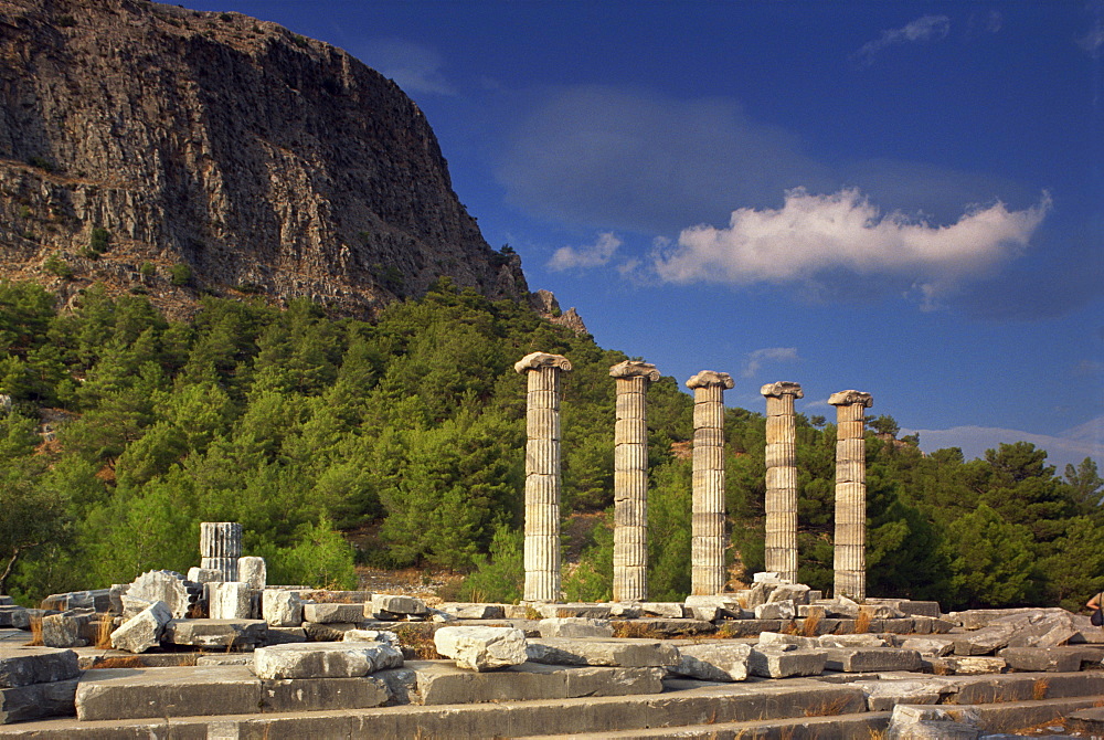 Columns and ruins of the Ionian Temple to Athena and the Greek theatre at the archaeological site of Priene, Anatolia, Turkey, Asia Minor, Eurasia