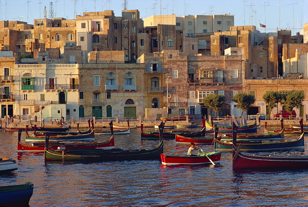 Boats moored in Valletta harbour at dusk, Malta, Mediterranean, Europe