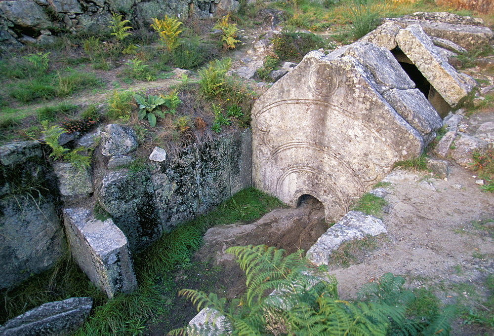 Citania de Briteiros, a Celtic iron age settlement dating from approximately 300 BC, with foundations of 150 huts, funerary chamber with carved doorway, near Braga, Minho, Portugal, Europe