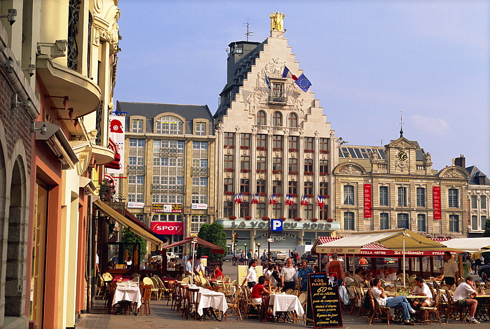 Pavement cafes and old buildings on the Grand Place in the city of Lille, Nord Pas de Calais, France, Europe