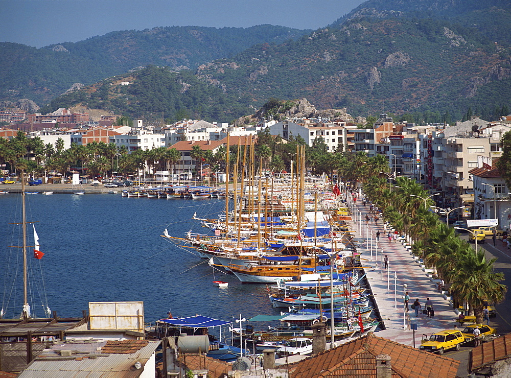 Gulets in the harbour with the town and hills in the background, at Marmaris, Anatolia, Turkey, Asia Minor, Eurasia