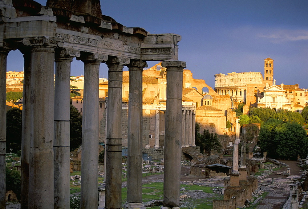 View across Roman Forum towards Colosseum and St. Francesca Romana, Rome, Lazio, Italy, Europe