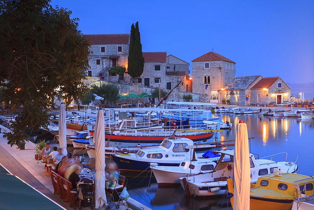 Harbour lit up at dusk, Bol, Brac Island, Dalmatian Coast, Croatia, Europe