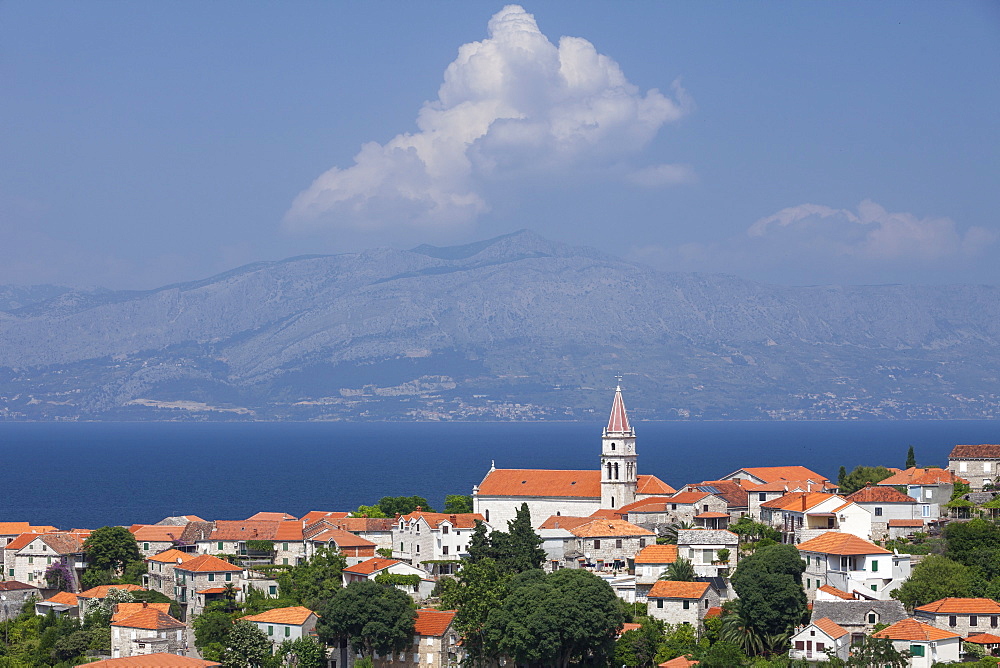 View of town with mainland in background, Postira, Brac Island, Dalmatian Coast, Croatia, Europe