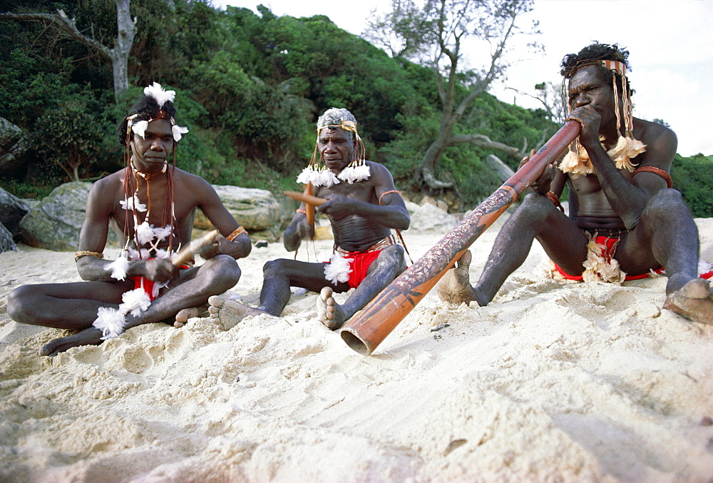 Three Aborigines playing musical instruments, Northern Territory, Australia, Pacific