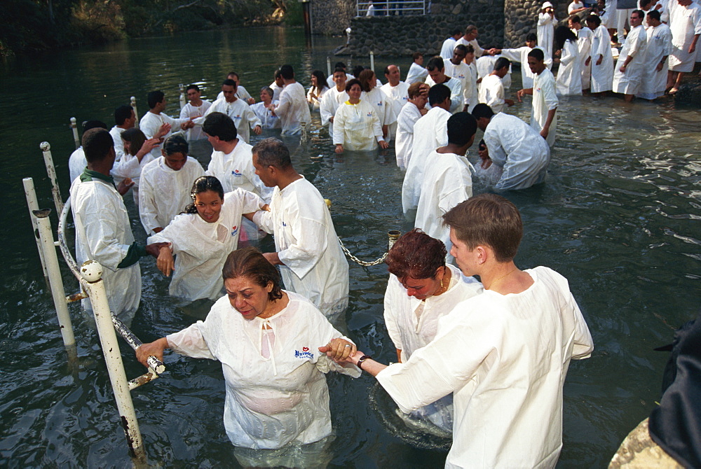 Ceremony of mass baptism into Christianity in the Sea of Galilee at Yardent, Israel, Middle East