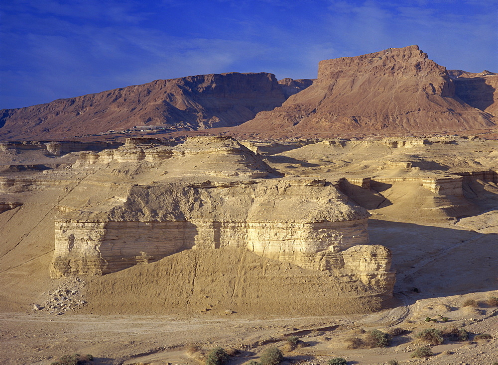 Rock cliffs and sand dunes in front of the fortress of Masada, in the Judean Desert, Israel, Middle East