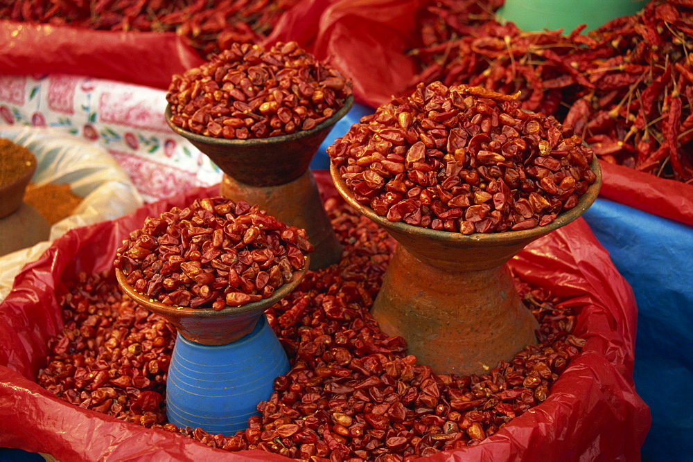 Dried red chillis in bowls for sale at San Cristobal de las Casas in Chiapas state, Mexico, North America