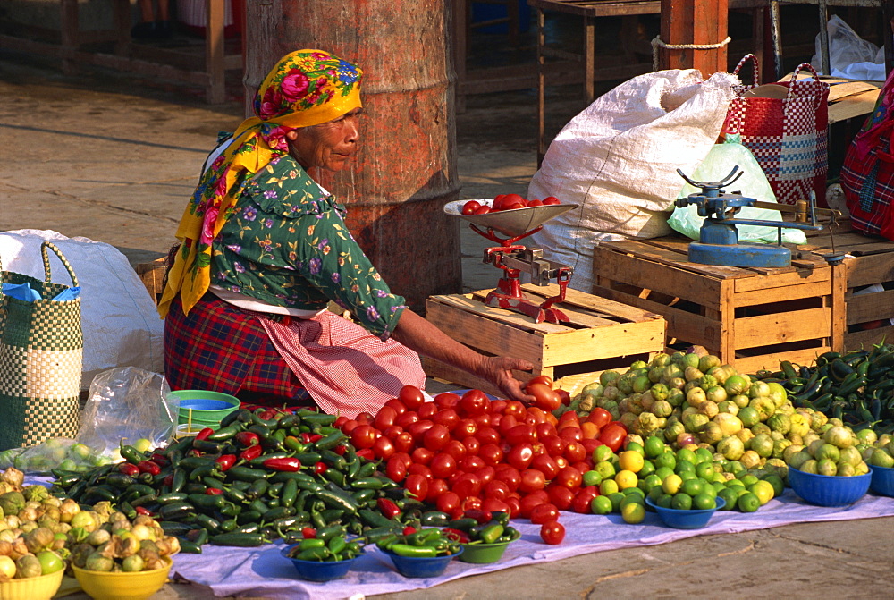 Woman selling vegetables from stall in Tlacolula Market, Oaxaca Region, Mexico, North America