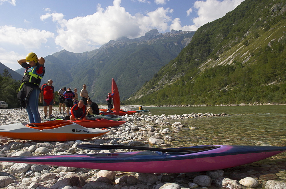 Group of people getting ready for canoeing on the Soca River, Triglav National Park, Julian Alps, Slovenia, Europe