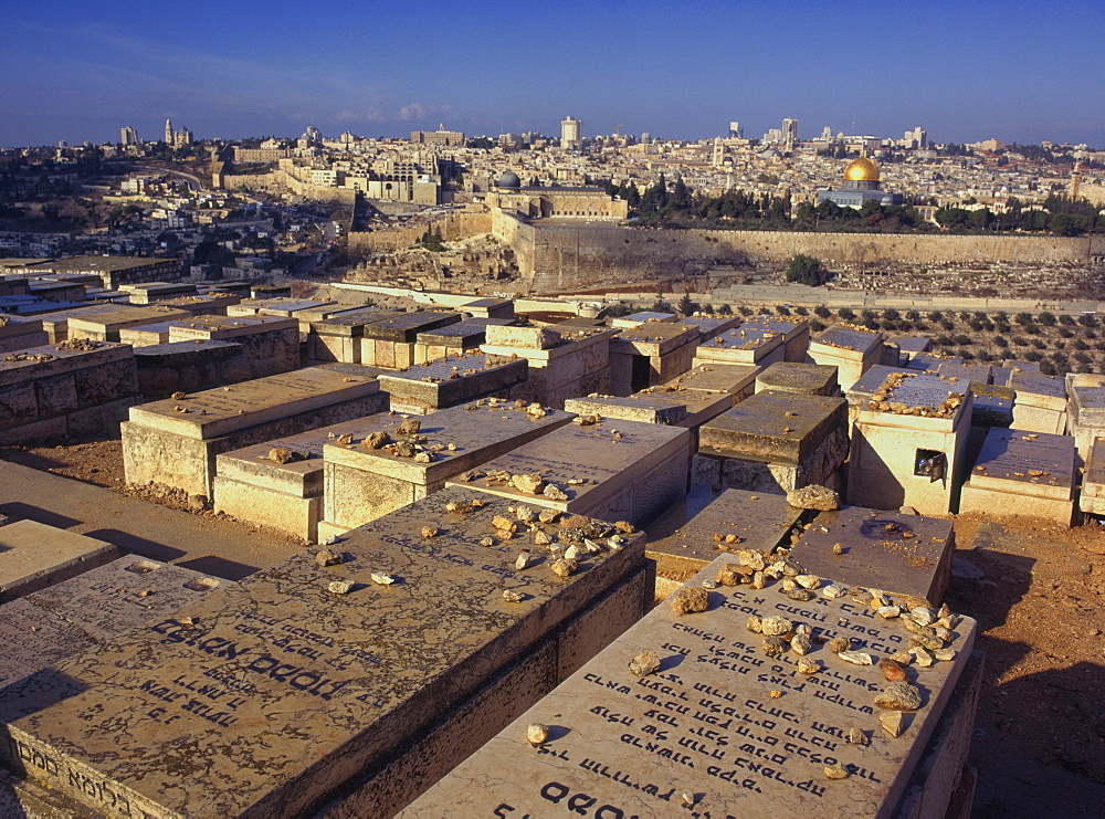 Jewish tombs in the Mount of Olives cemetery, with the Old City beyond, Jerusalem, Israel, Middle East