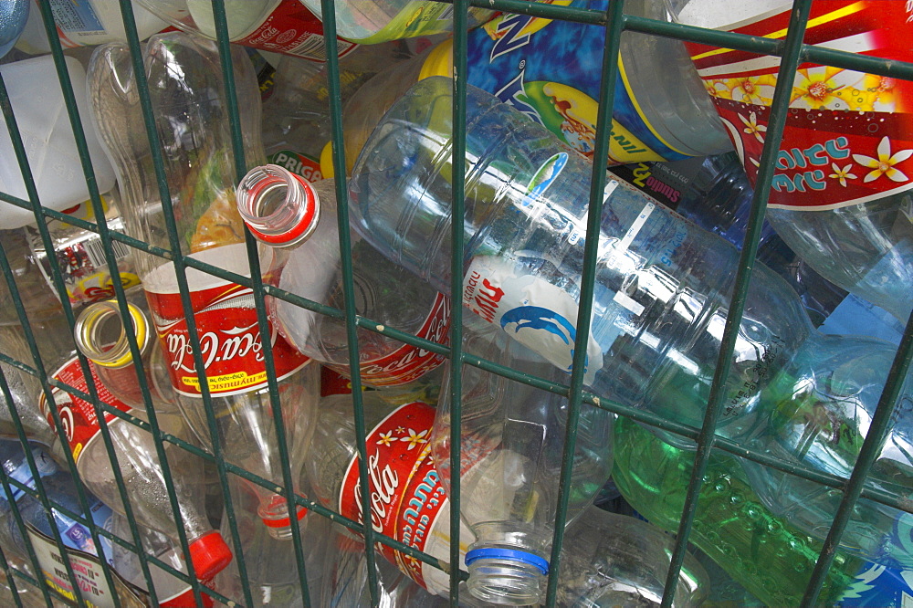 Empty plastic bottles in a recycling container