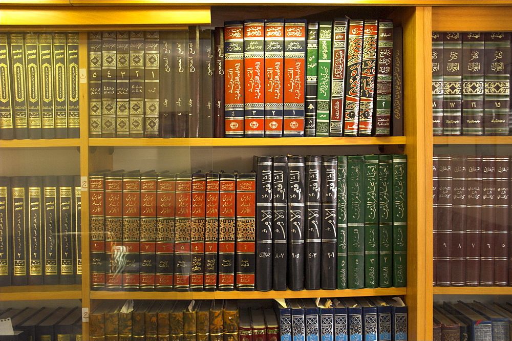 Religious books in Arabic on shelves, Ahmedi's community, village of Kababir, Haifa, Israel, Middle East