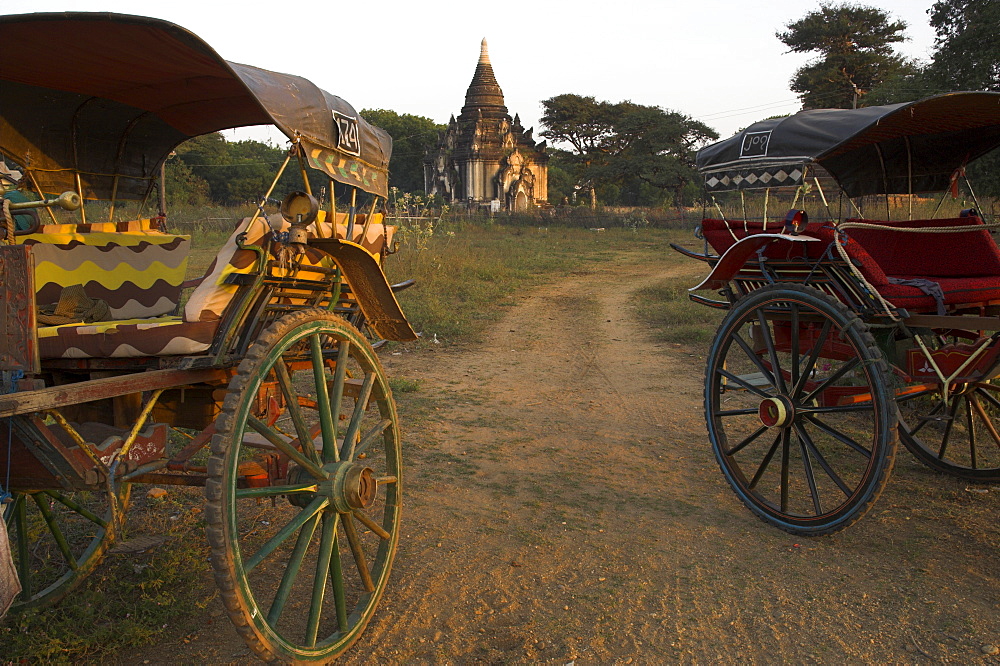 View at sunset with horse cart and typical temple, Bagan (Pagan), Myanmar (Burma), Asia