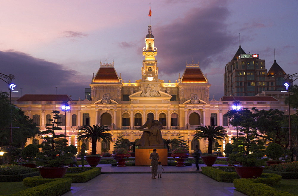 Hotel de Ville (People's Committee Building) with public garden in foreground at dusk, Ho Chi Minh City (Saigon), Vietnam, Indochina, Southeast Asia, Asia