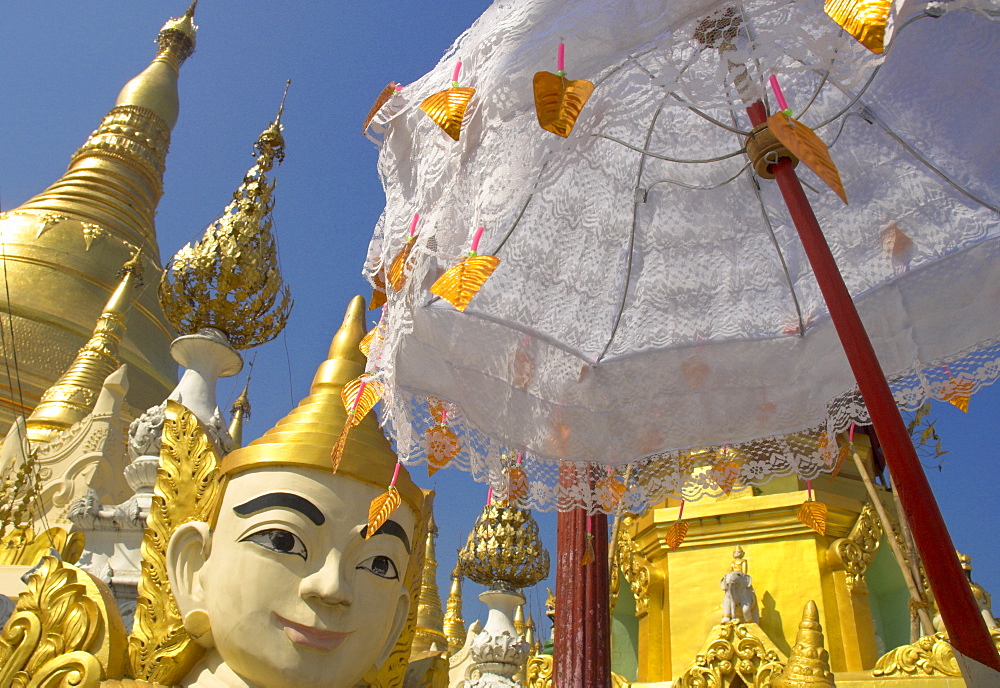 Mystical figure, white umbrella and golden stupas, Shwedagon Paya, Yangon (Rangoon), Myanmar (Burma), Asia