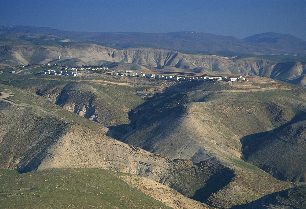 View in winter with typical hills in foreground and Alon settlement beyond, Judean Desert, Israel, Middle East