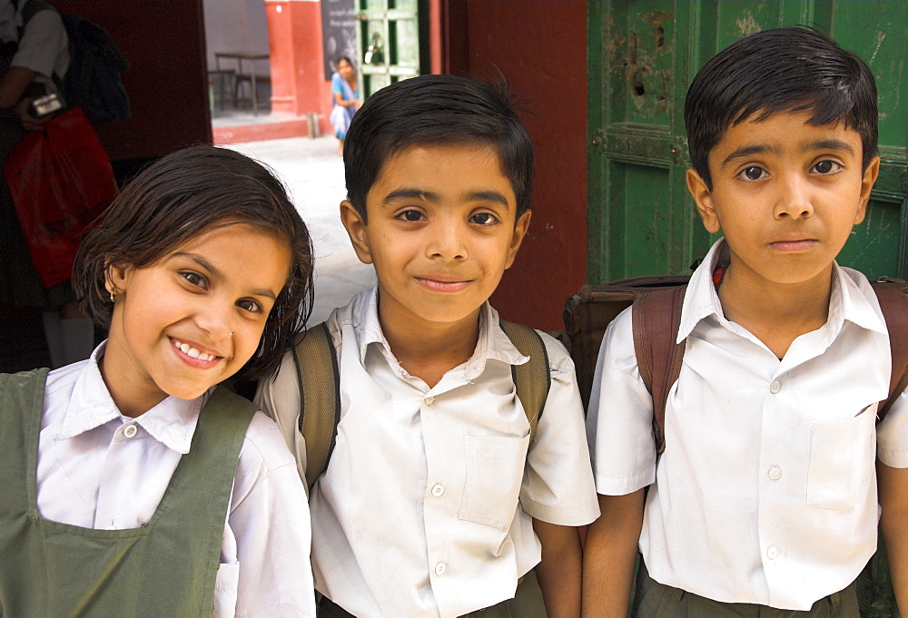 Portrait of 3 young school children, Old City, Udaipur, Rajasthan, India