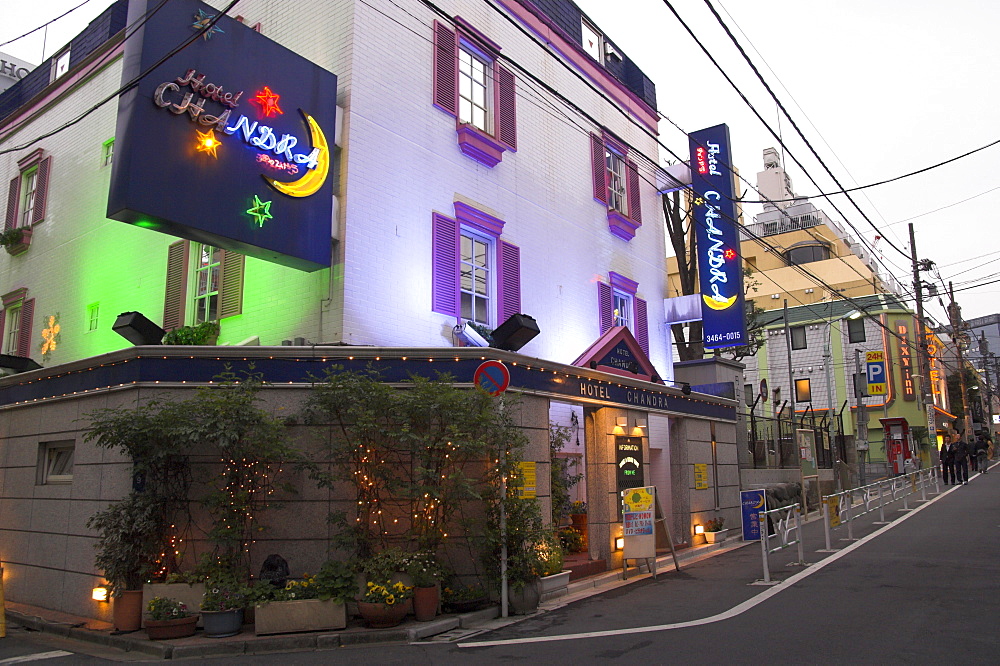 View at dusk of a street with row of love hotels, Dogenzaka, Shibuya, Tokyo, Honshu, Japan, Asia