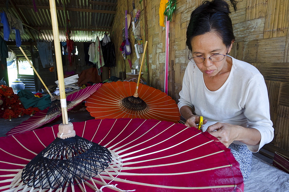 Woman at work at an umbrella workshop, Pathein, Irrawaddy Delta, Myanmar (Burma), Asia