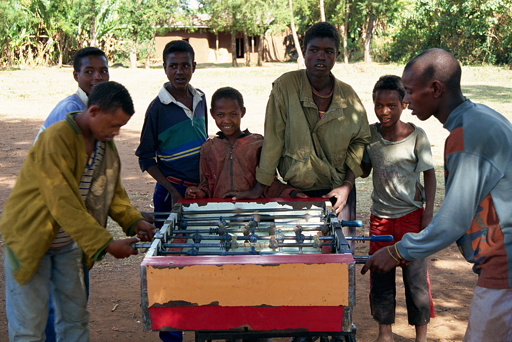 Children playing table football, Bonga Forest, Ethiopia, Africa