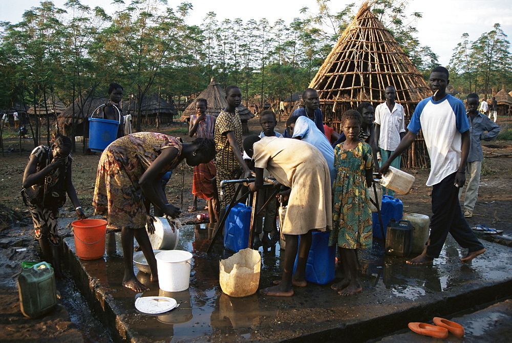 Women collecting water at the Dimma Refugee Camp, Ethiopia, Africa