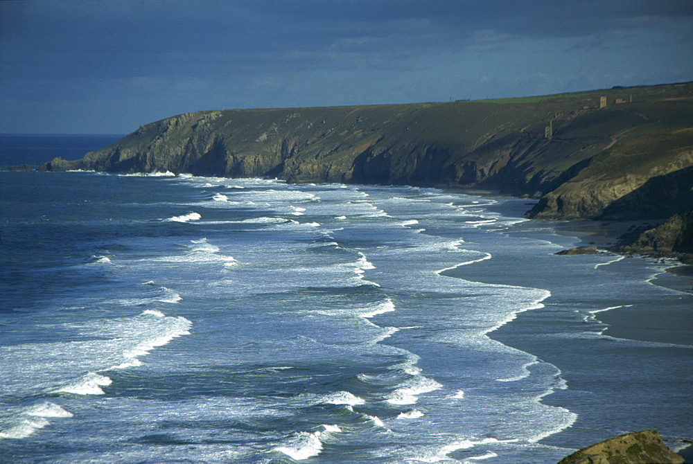 Tin mining chimneys and ocean surf, Porthtowan, Cornwall, England, United Kingdom, Europe