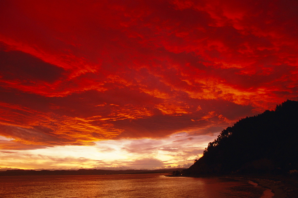 Red sky, sunset over the bay, Gisborne, East Coast, North Island, New Zealand, Pacific