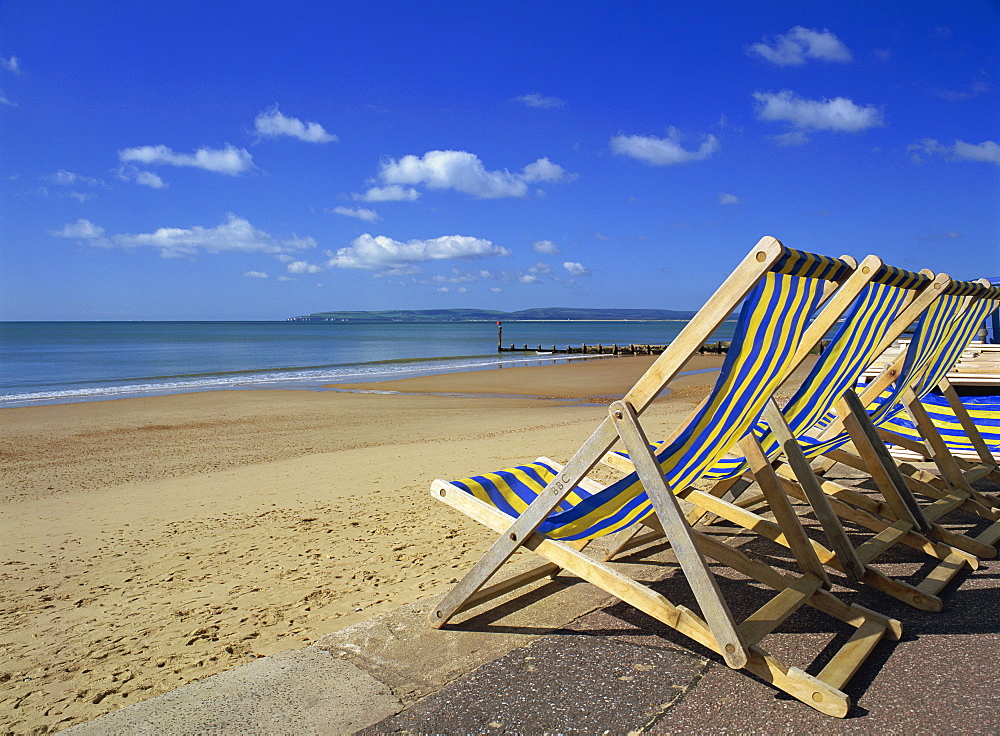 Deckchairs on the Promenade overlooking deserted beach, West Cliff, Bournemouth, Dorset, England, United Kingdom, Europe